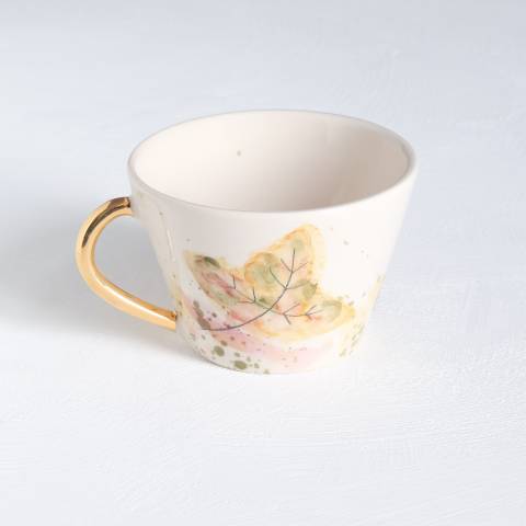Autumn leaves in Brown tea cup